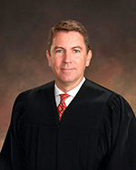 Portrait of Speaker Name